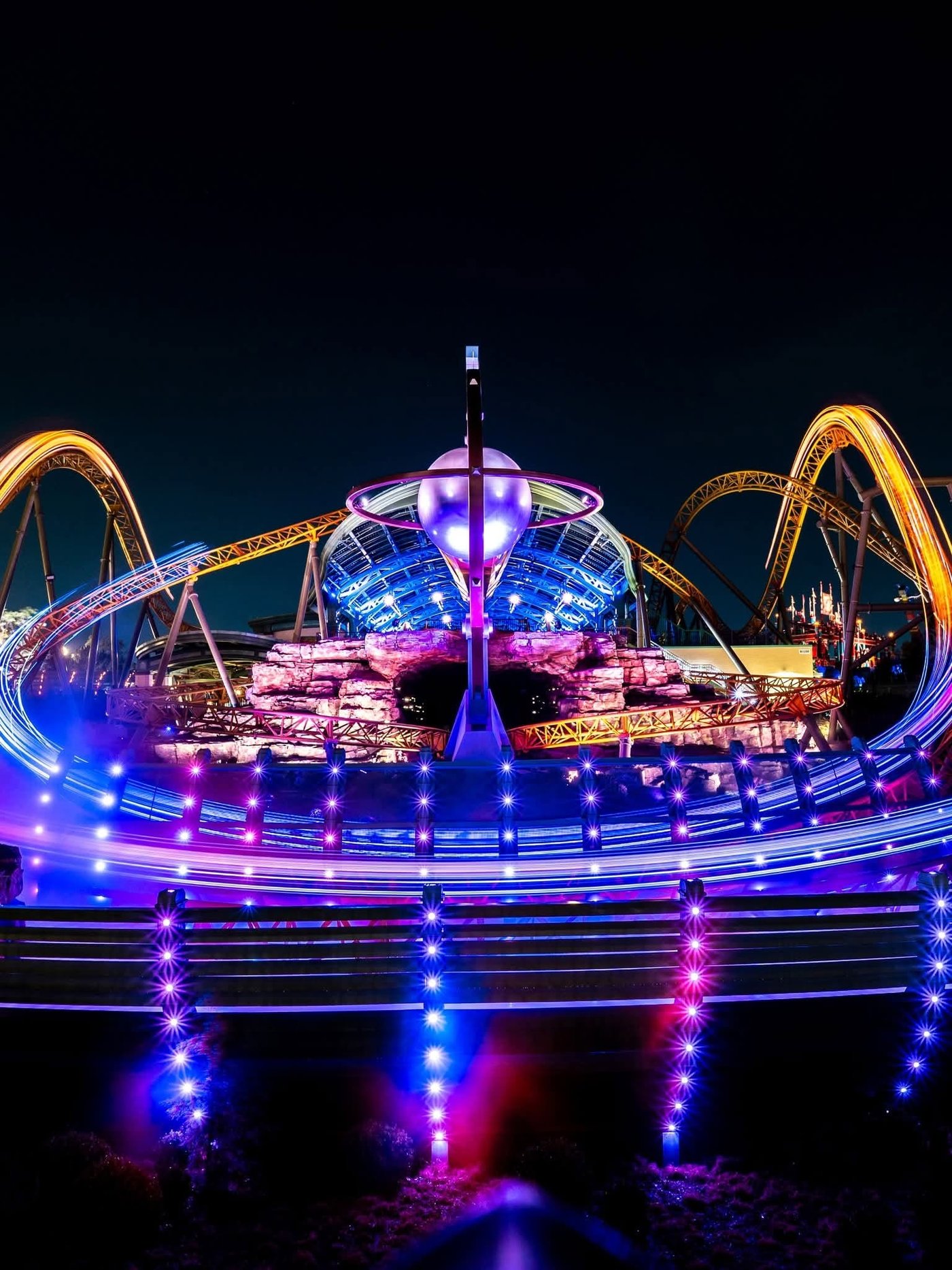 Epic Universe — Isle of Berk roller coaster night shot